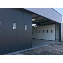 Porte sectionnelle industrielle coulissante FREEDIM Largeur 22000mmx Hauteur 4000mm avec portillon
