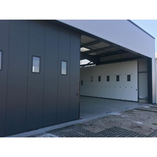 Porte sectionnelle industrielle coulissante LIBERTE Largeur 14000mmx Hauteur 3200mm