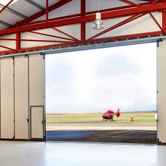 Porte sectionnelle industrielle coulissante FREEDIM Largeur 22000mmx Hauteur 4000mm avec portillon